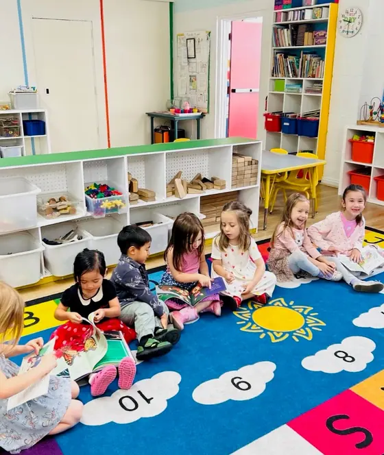 Bright Start children reading picture books together on the classroom rug
